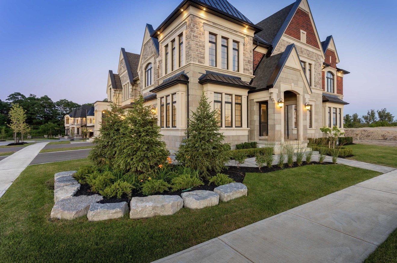 Mc.Angel project: residential exterior with stone detailing and landscaping