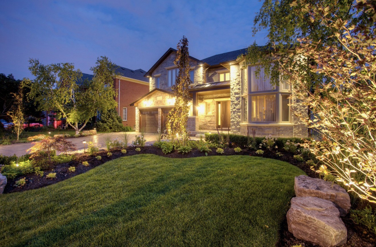 Residential garden with natural stone and landscape lighting