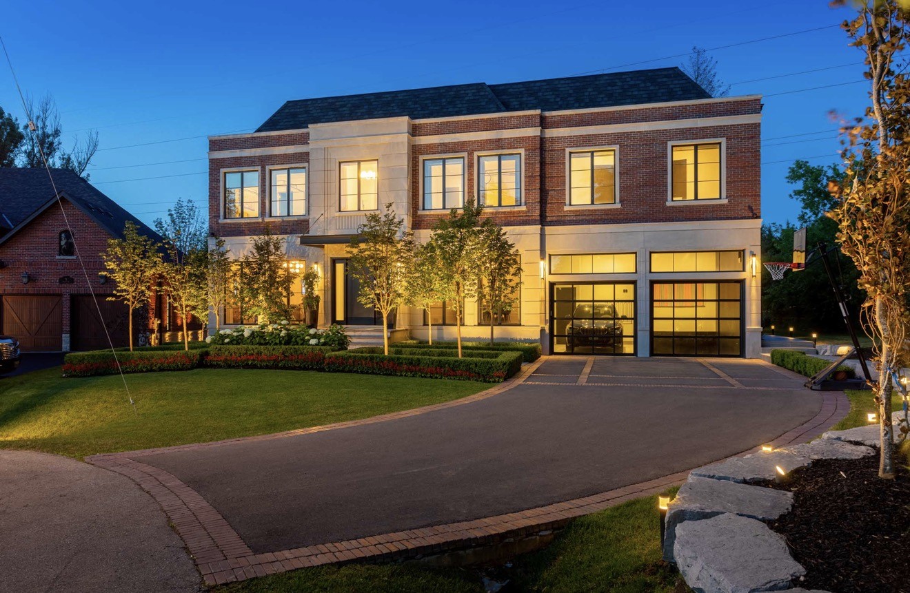 Contemporary residential exterior and driveway at dusk