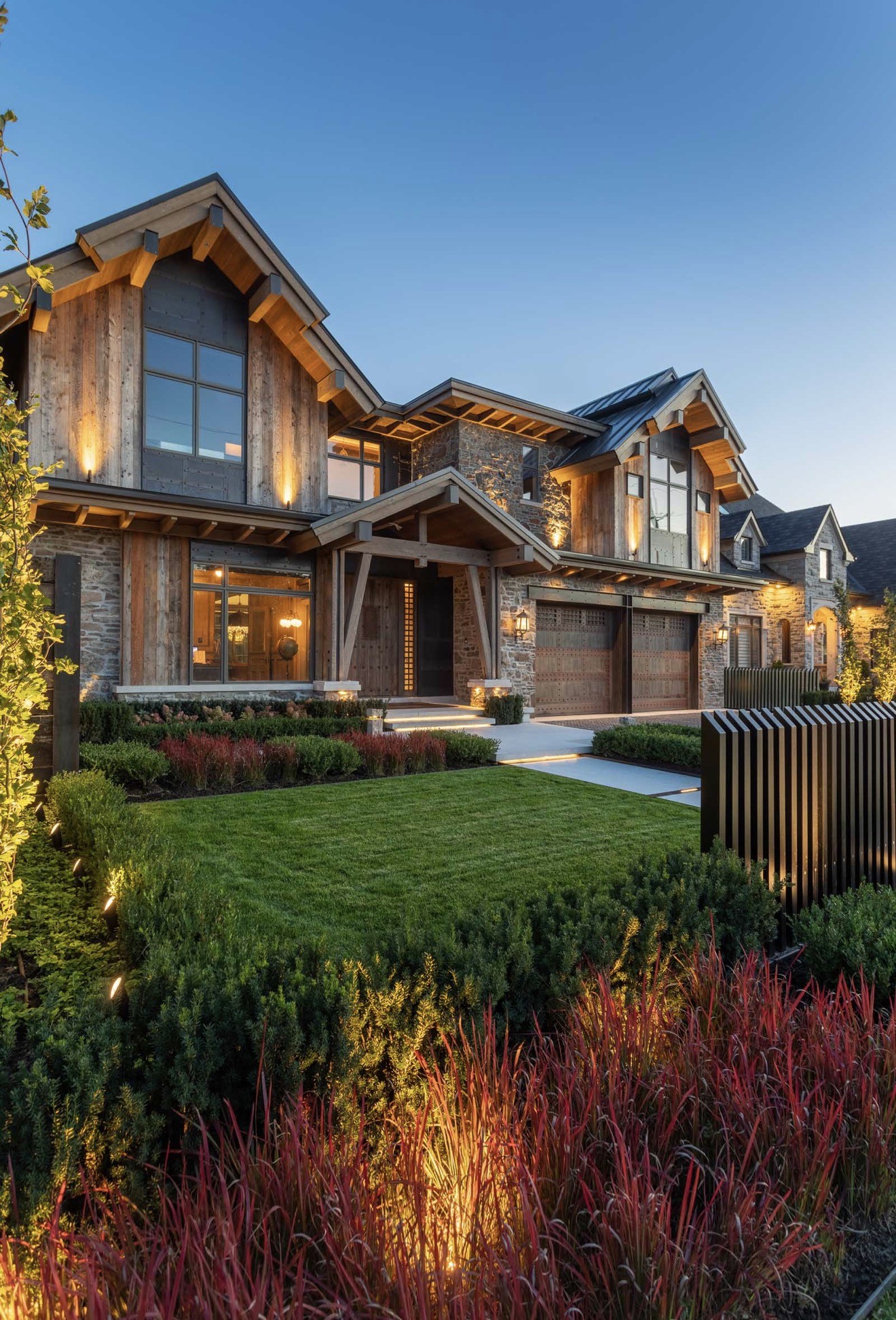 Residential exterior framed by lawn and planting